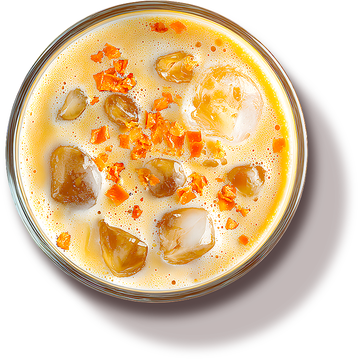 An iced citrus coffee with bright orange garnish